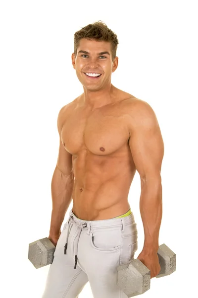 Young man exercising with dumbbells — Stock Photo, Image