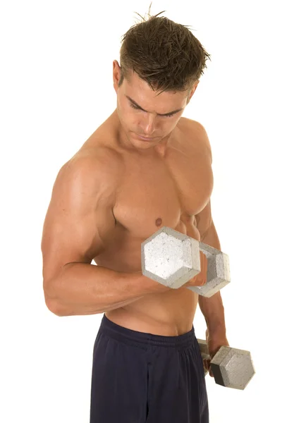 Young man exercising with dumbbells — Stock Photo, Image