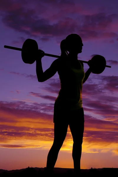 Silhouette della donna che esercita — Foto Stock