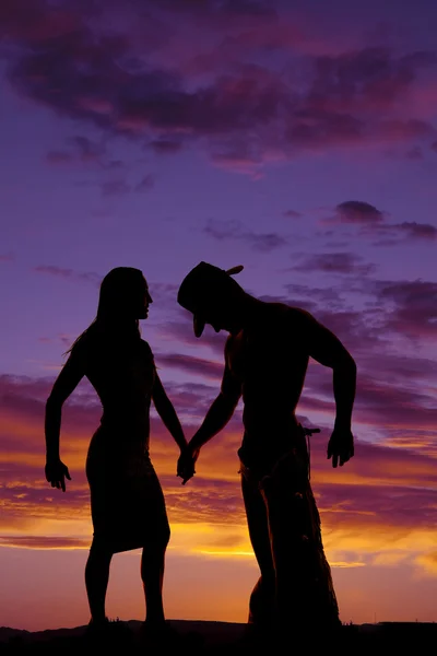 Silhuett av cowgirl och cowboy — Stockfoto