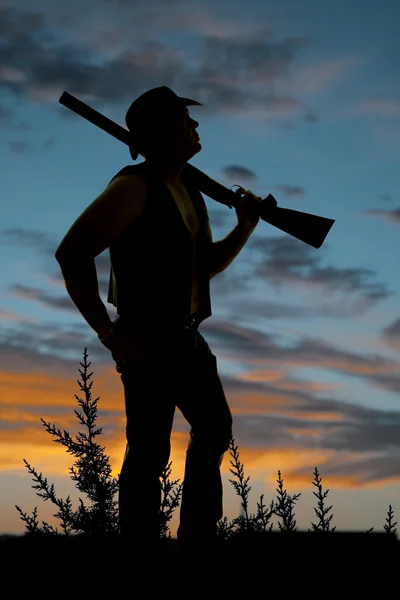 Silhouette of cowboy with shotgun — Stock Photo, Image