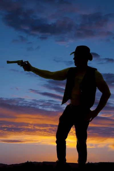 Silhouette of cowboy with pistol — Stock Photo, Image
