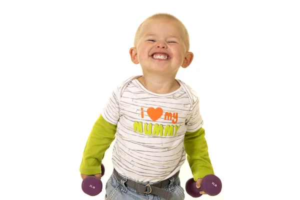 Little boy exercising with weights — Stock Photo, Image