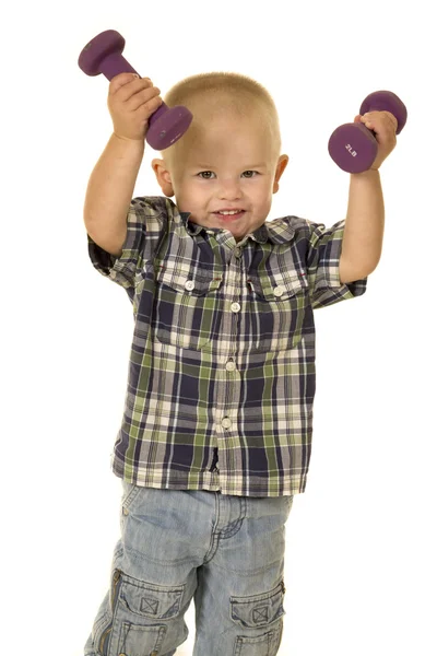 Niño pequeño haciendo ejercicio — Foto de Stock