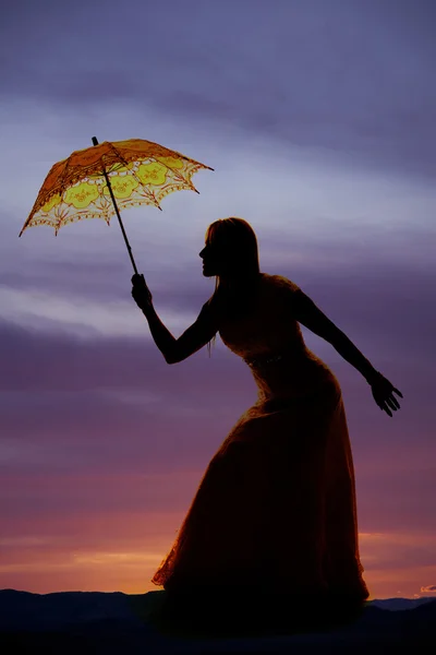 Silhouette of woman with umbrella — Stock Photo, Image