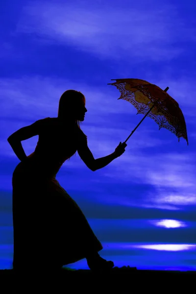 Silhouette of woman with umbrella — Stock Photo, Image