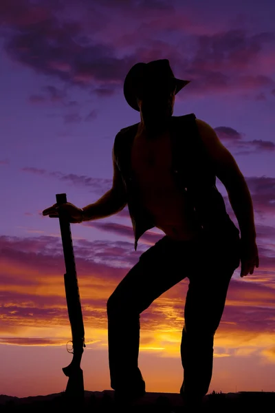 Silhouette of cowboy with shotgun — Stock Photo, Image