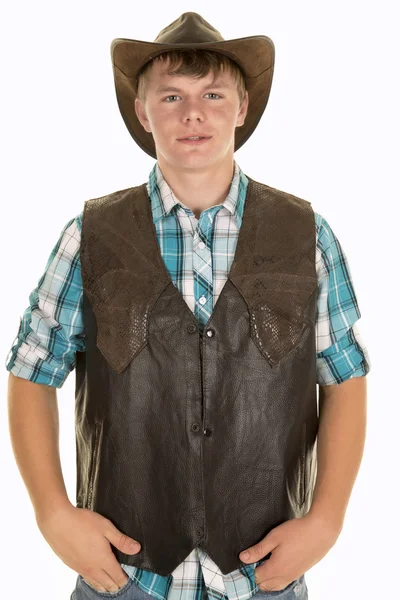 Jovem cowboy em colete olhando — Fotografia de Stock