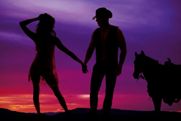 Silhouette von Frau, Cowboy und Pferd — Stockfoto