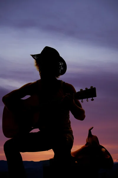 Sziluettjét cowboy gitározni — Stock Fotó