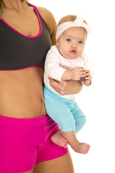 Fitness kadın holding küçük bebek — Stok fotoğraf