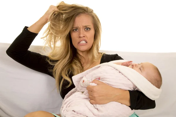 Sad woman sitting with baby — Stock Photo, Image