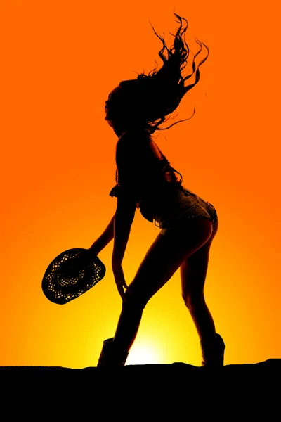 Silhouette cowgirl shorts butt out hat down — Stock Photo, Image