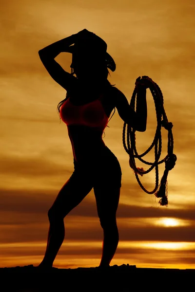 Silhuett av cowgirl hålla repet — Stockfoto