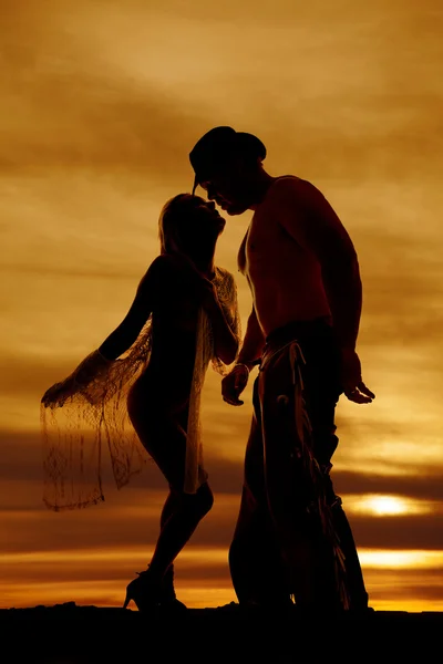 Silhouette of a woman wrapped in sheer cloth with cowboy — Stock Photo, Image