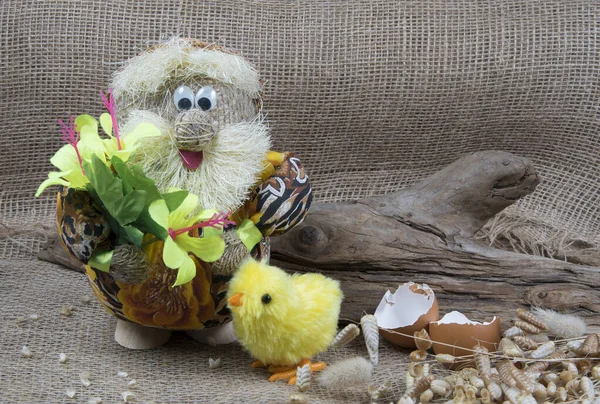 Brownie, house spirit with easter chick. Cute goblin from folk tales. Hand-made from burlap. Copyspace