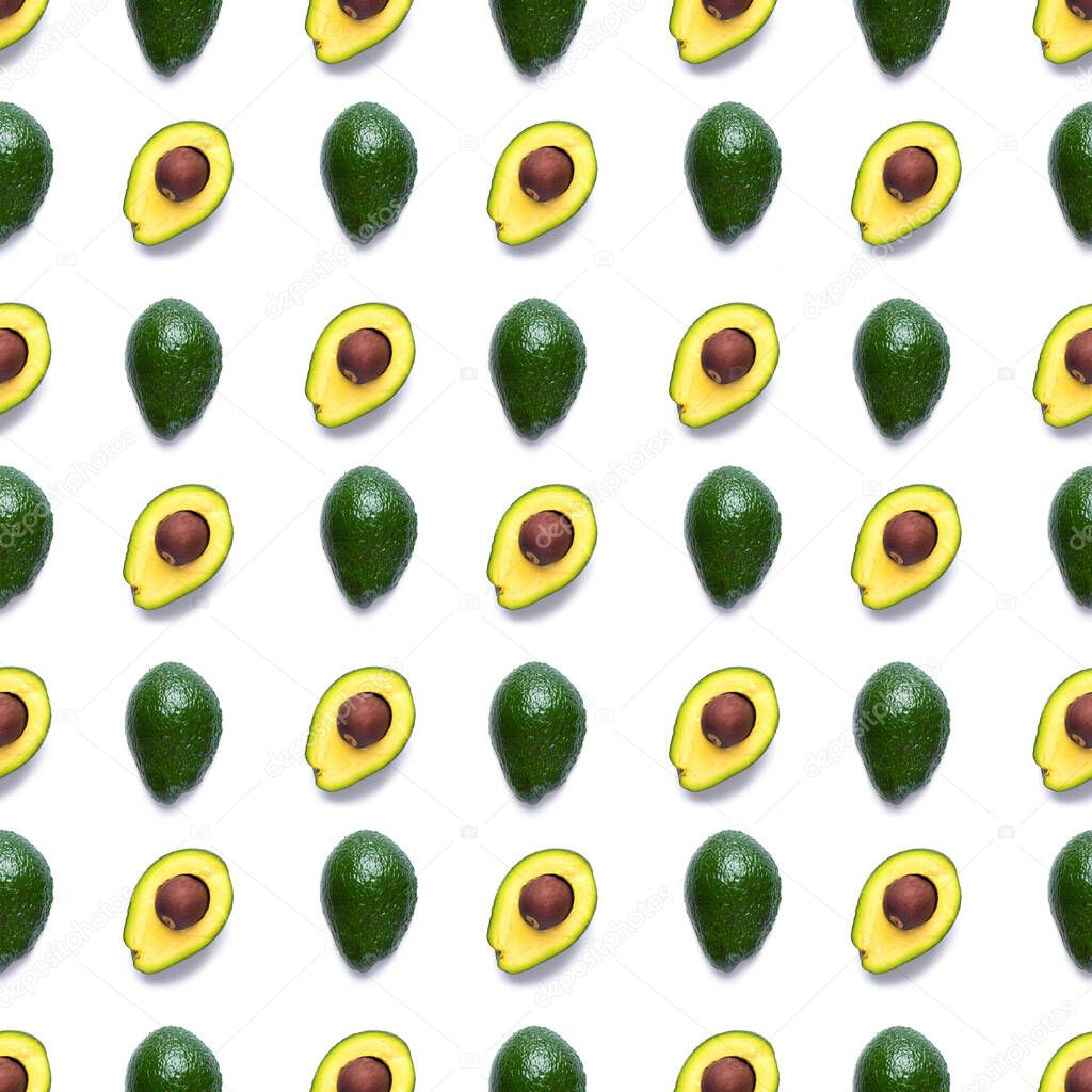 Avocado seamless pattern. Background made from isolated avocado pieces on white background. Flat lay of whole and half avocados, avacado pieces and seeds.