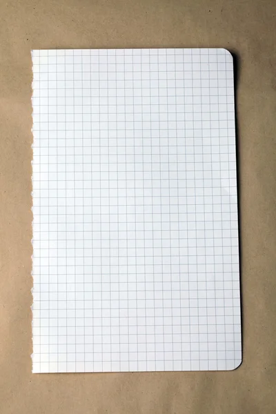 Nota verificada sobre fundo de papel artesanal — Fotografia de Stock
