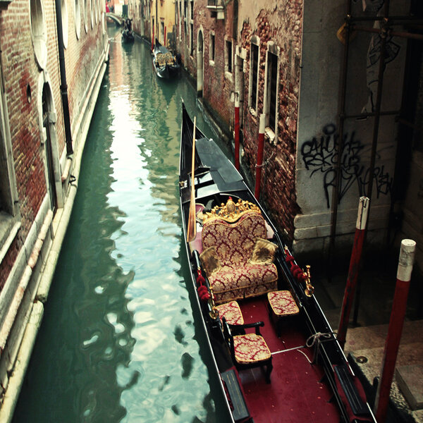 typical gondola at narrow venetian canal, Venice, Italy. 