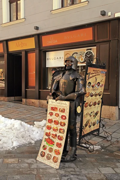 Street cafe menu board and knight in Old Town, Bratislava — Stock Photo, Image