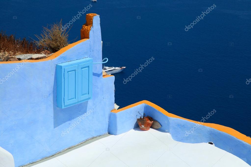 colorful terrace above Aegean sea, Oia village, Santorini, Greec