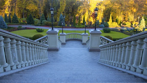 Beautiful classical staircase with autumn park view — Stock Photo, Image