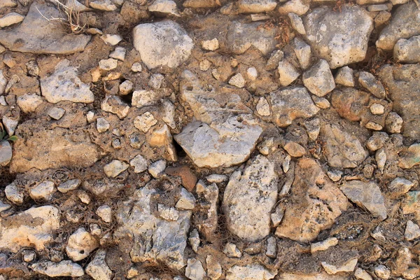 Sfondo muro di pietra marrone intemperie — Foto Stock