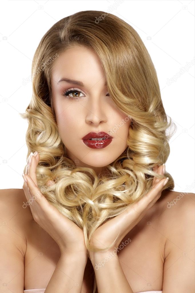 Beautiful young blond model curly hair posing