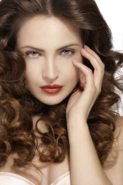 Beautiful model showing healthy brown wavy hair — Stock Photo, Image