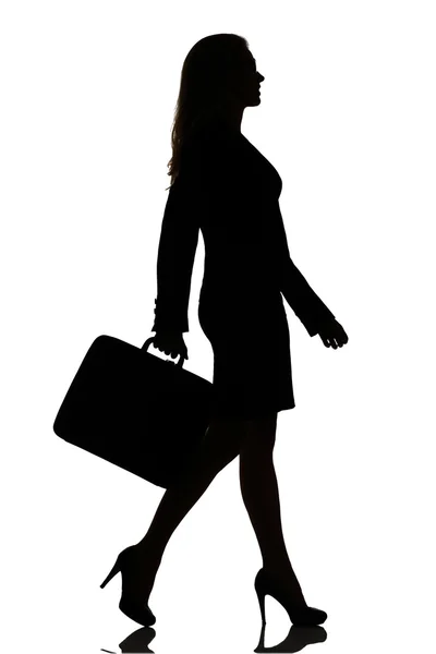 Silhouette of a busy business woman backlight studio — Stock Photo, Image