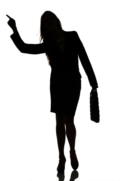 Silhuetten av en upptagen business woman bakgrundsbelysning studio — Stockfoto