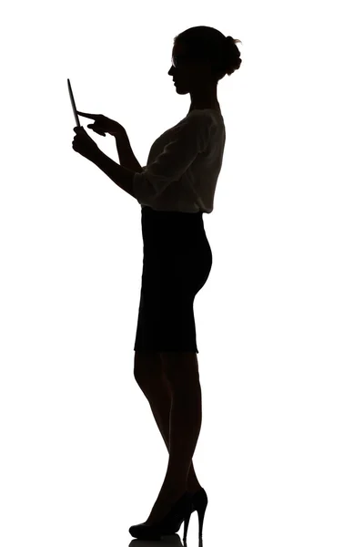 Silhouette of a busy business woman backlight studio — Stock Photo, Image