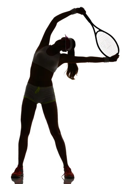 Uma mulher tenista em silhueta estúdio isolado — Fotografia de Stock