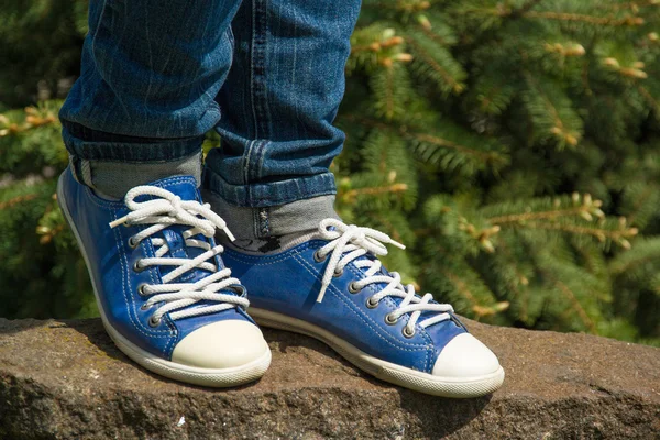 Blue sneakers with white laces — Stock Photo, Image