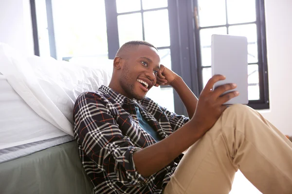 Guy using digital tablet at home — Stock Photo, Image