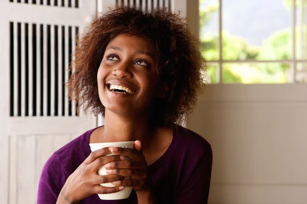 Happy young woman with cup of coffee — Stock Photo, Image