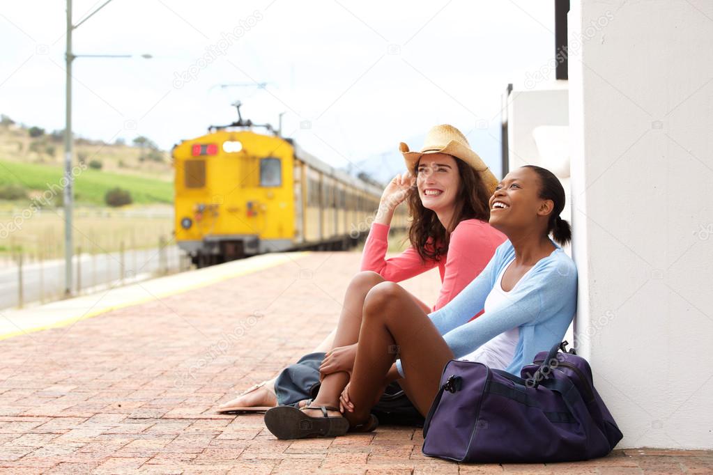 Female friends waiting for train
