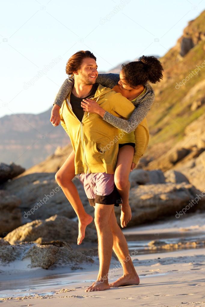 Man carrying woman on his back