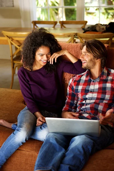 Young man and woman with laptop — Stock Photo, Image