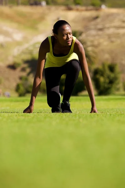 Woman at start line ready to run — Stock Photo, Image