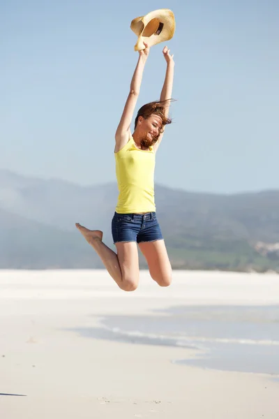 Excited young woman jumping y — Stock Photo, Image