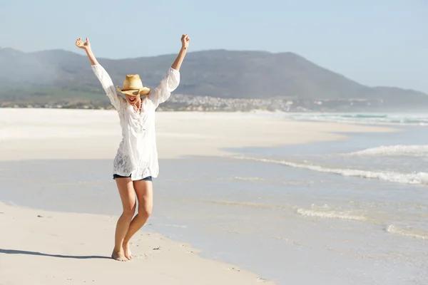 Young lady celebrating on the beach — Stock Photo, Image