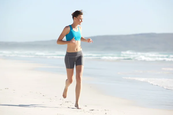 Ajuste mujer joven corriendo —  Fotos de Stock
