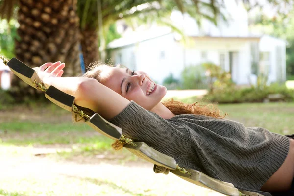 Laughing woman lying in hammock — Stock Photo, Image