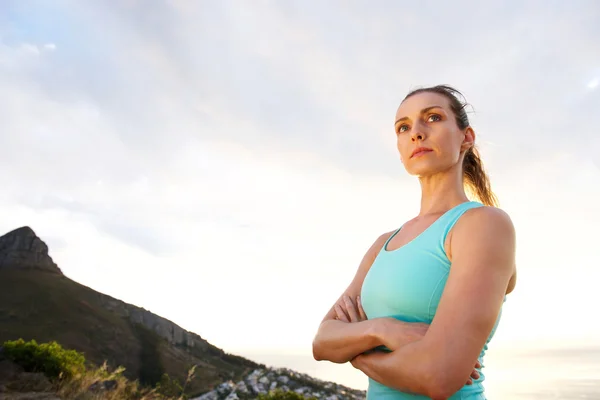 Sport woman with arms crossed staring — Stock Photo, Image