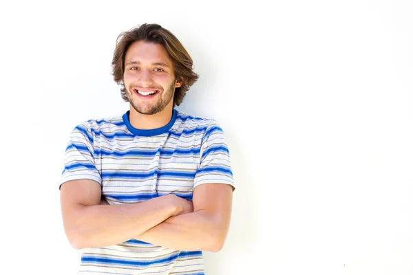 Smiling young man with arms crossed — Stock Photo, Image