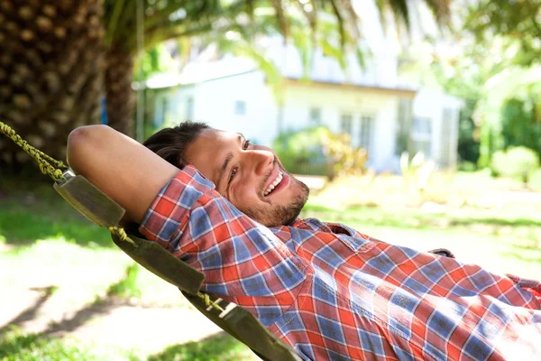 Attractive young man lying in hammock — Stock Photo, Image