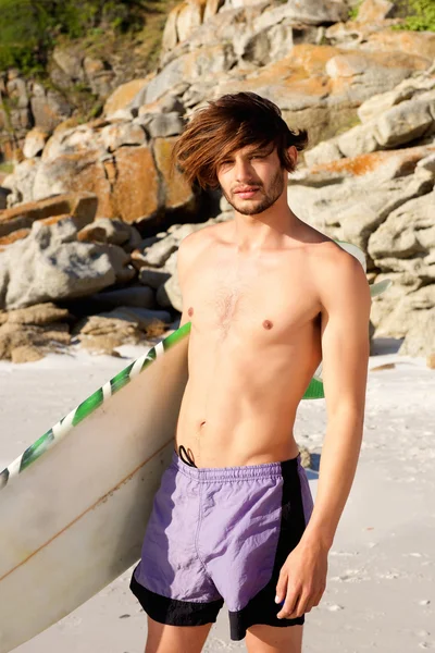 Cool surfer holding surfboard — Stock Photo, Image