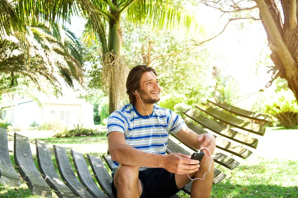 Young man sitting on hammock — Stock Photo, Image