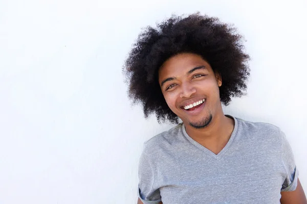 Happy young man against white background — Stock Photo, Image